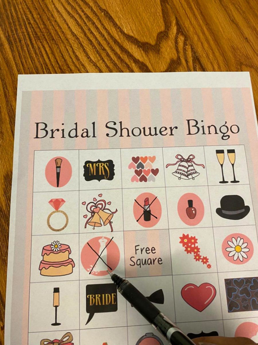 A player playing bridal shower picture bingo